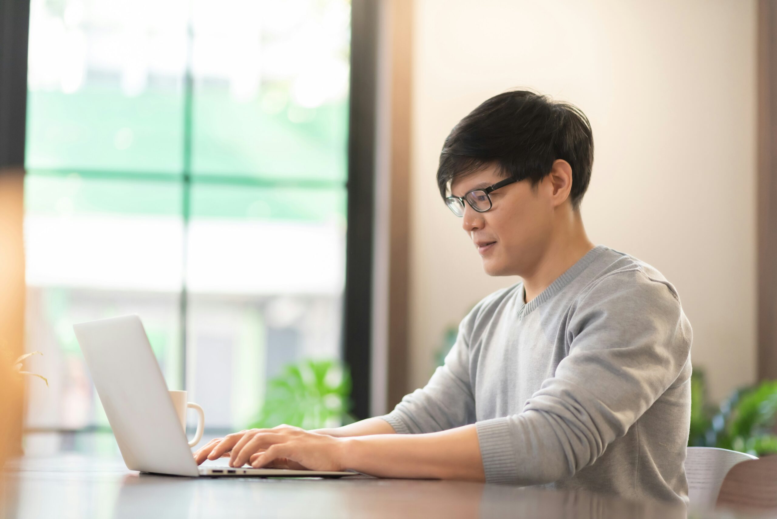 Young man working from his laptop