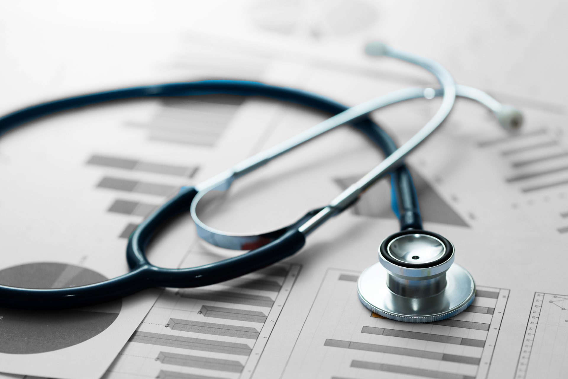 Stethoscope on top of a pile of papers