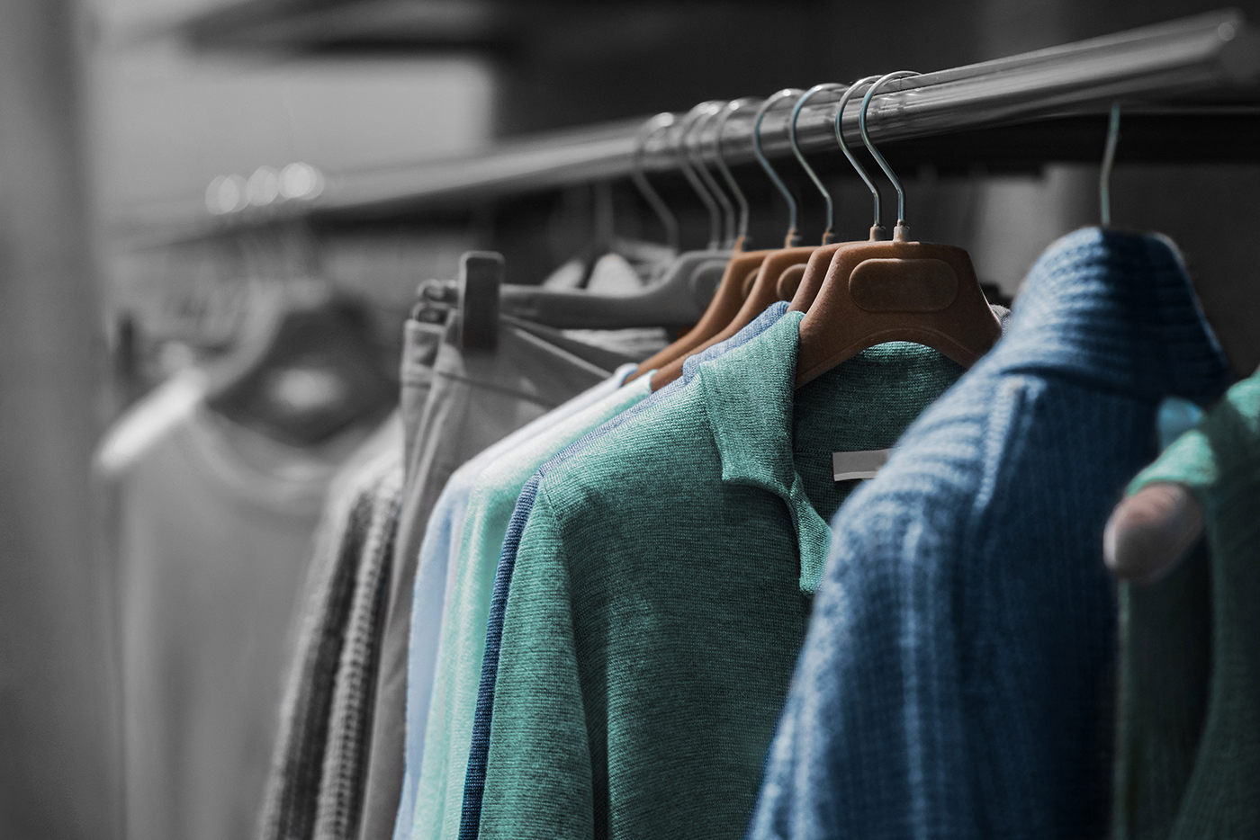 Clothes hanging on a rack in a shop