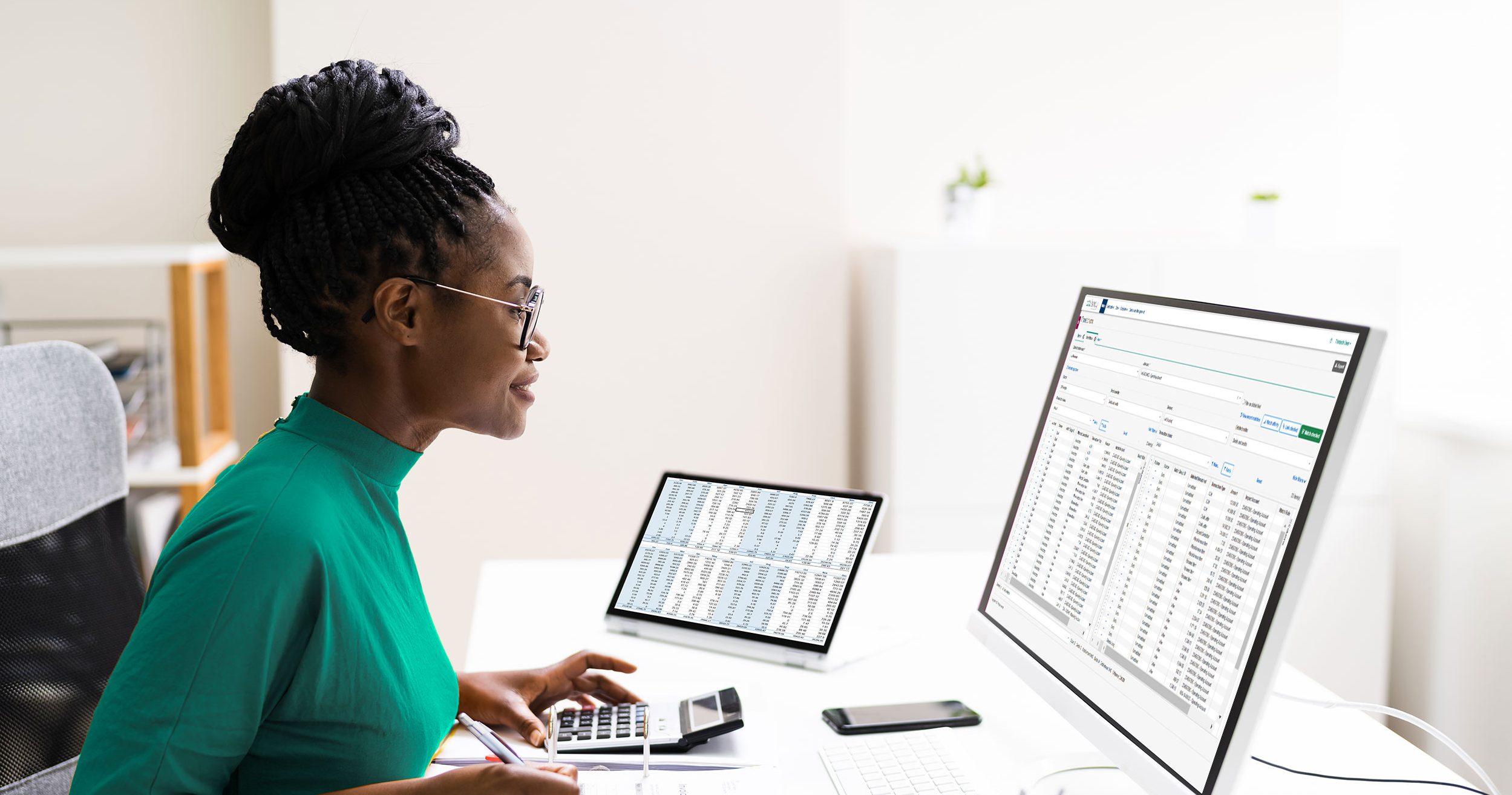 Lady sitting at desk working on computer