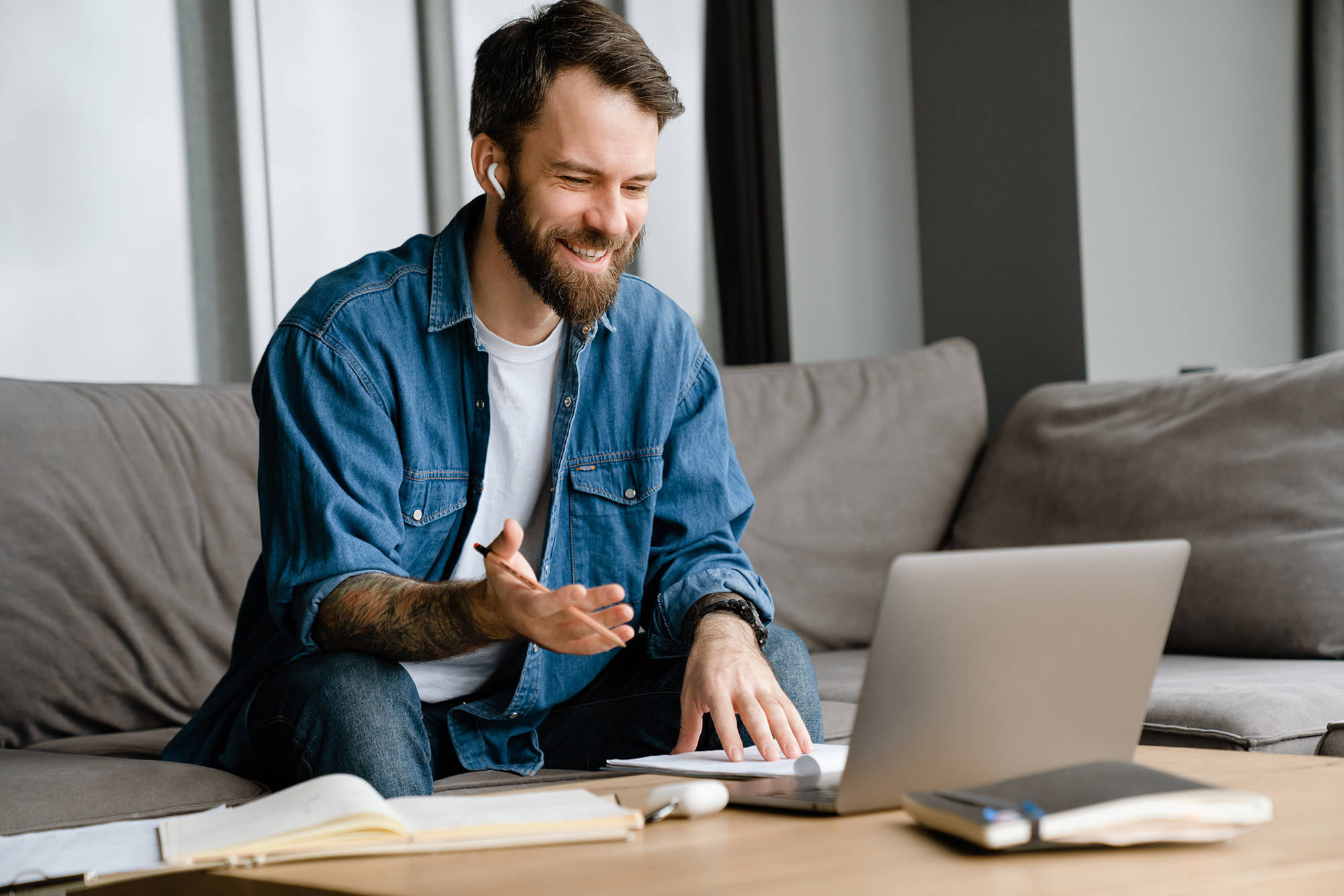Professional collaborating remotely on AI-powered financial reporting tasks via laptop video call
